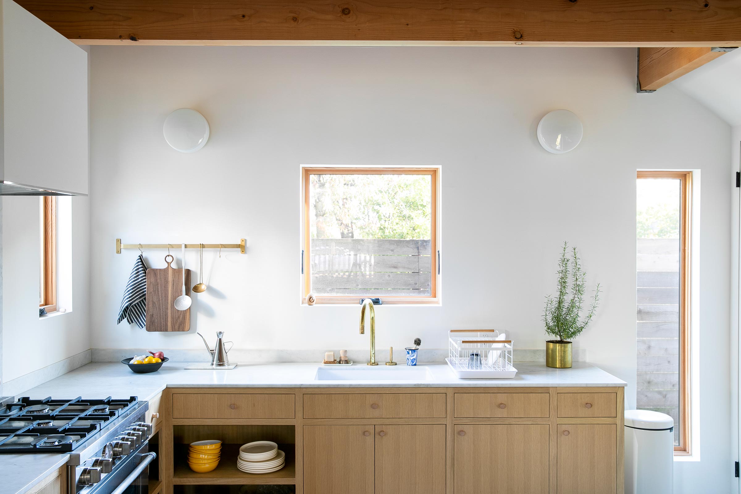 https://www.schoolhouse.com/cdn/shop/articles/a-modern-kitchen-with-exposed-beams.jpg?v=1678146666&width=2400