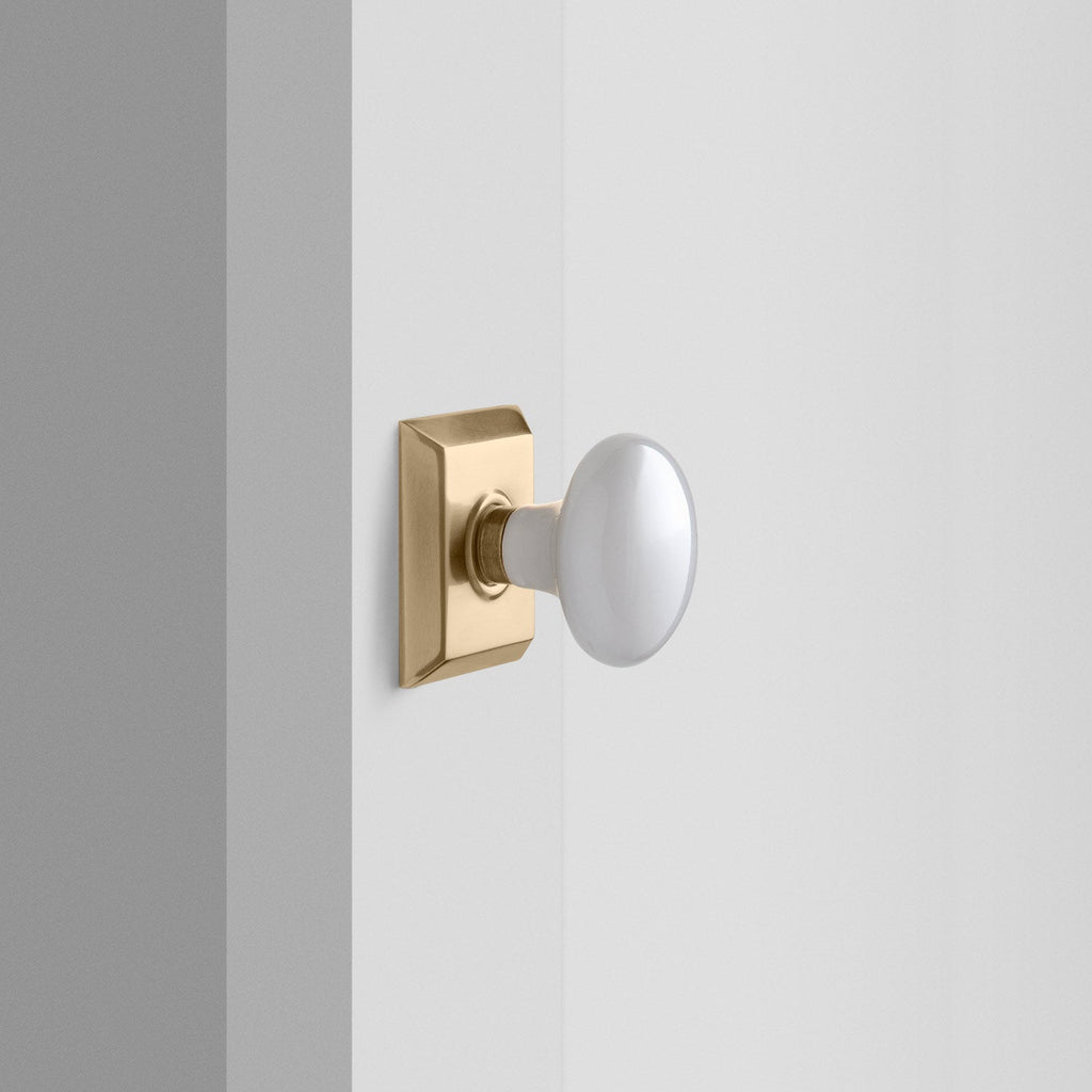 Freeport Small Backplate Doorset with Porcelain Knob - Antique Brass